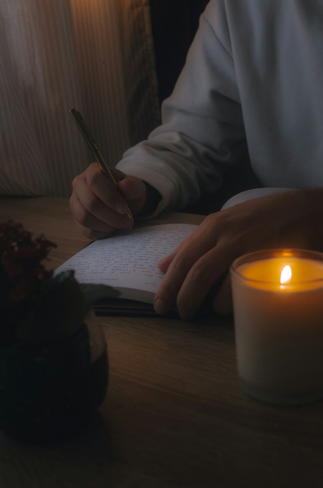 person writing in journal