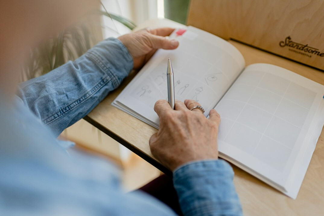 person journaling at desk