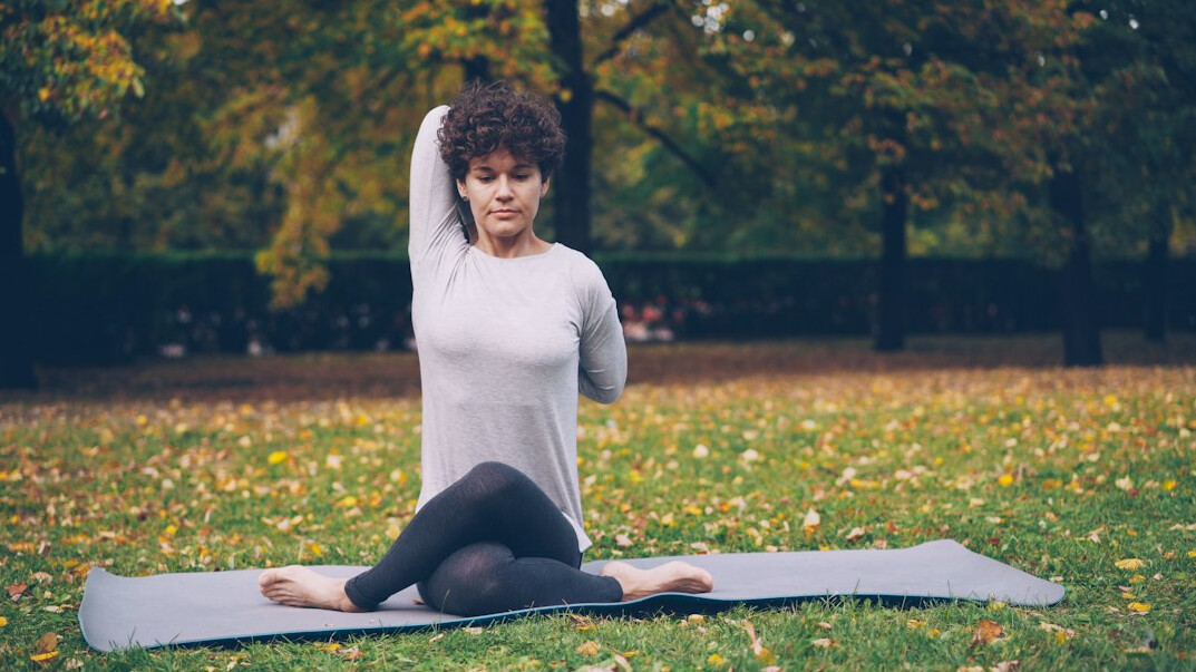 person doing yoga outdoors